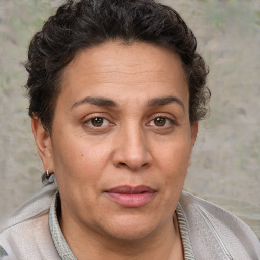 Joyful white adult female with short  brown hair and brown eyes