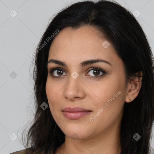 Joyful latino young-adult female with long  brown hair and brown eyes