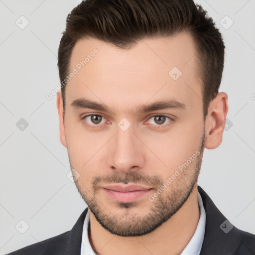 Neutral white young-adult male with short  brown hair and brown eyes