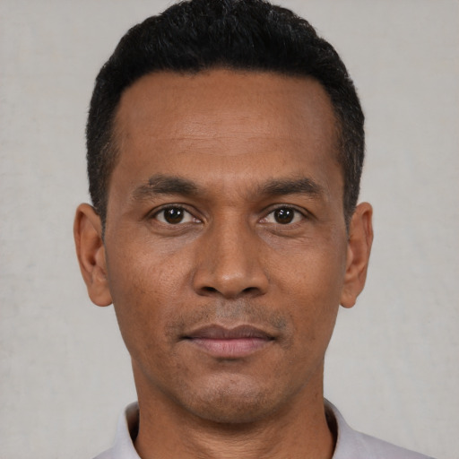 Neutral black young-adult male with short  black hair and brown eyes