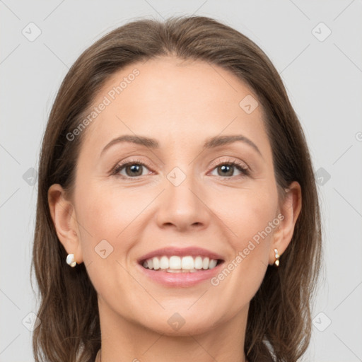 Joyful white adult female with medium  brown hair and grey eyes