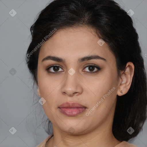 Joyful latino young-adult female with medium  brown hair and brown eyes