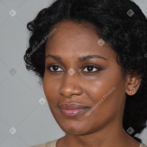 Joyful black young-adult female with medium  black hair and brown eyes