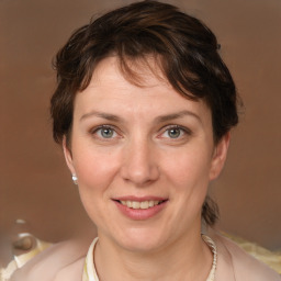 Joyful white young-adult female with medium  brown hair and grey eyes