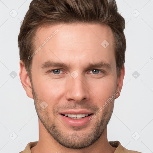 Joyful white young-adult male with short  brown hair and grey eyes