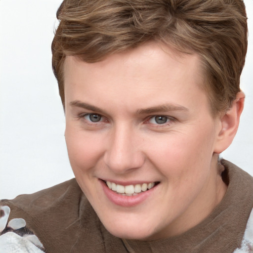 Joyful white young-adult female with short  brown hair and grey eyes