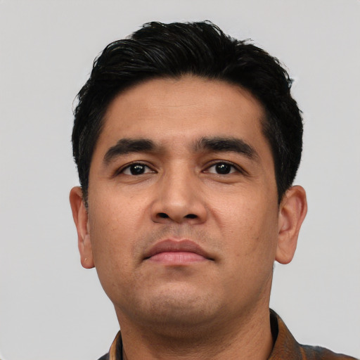 Neutral latino young-adult male with short  black hair and brown eyes