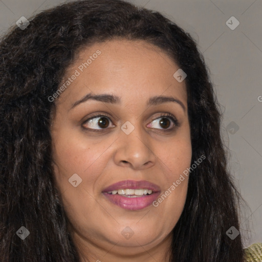 Joyful black young-adult female with long  brown hair and brown eyes