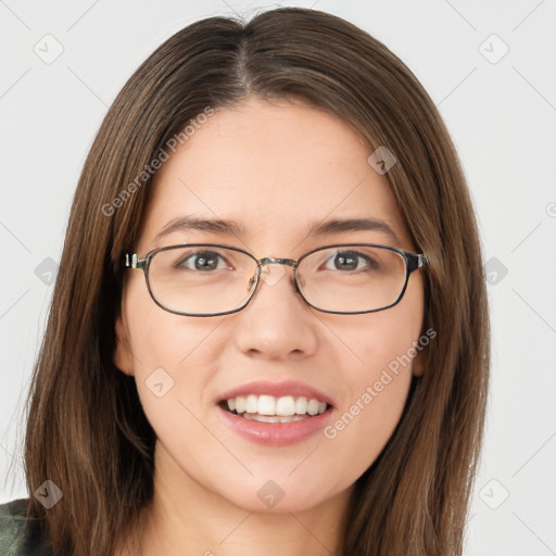 Joyful white young-adult female with long  brown hair and green eyes