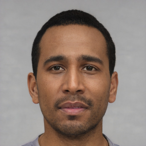 Neutral black young-adult male with short  black hair and brown eyes