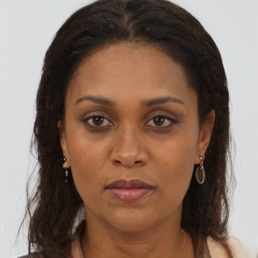 Neutral black adult female with long  brown hair and brown eyes