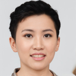 Joyful asian young-adult female with short  black hair and brown eyes