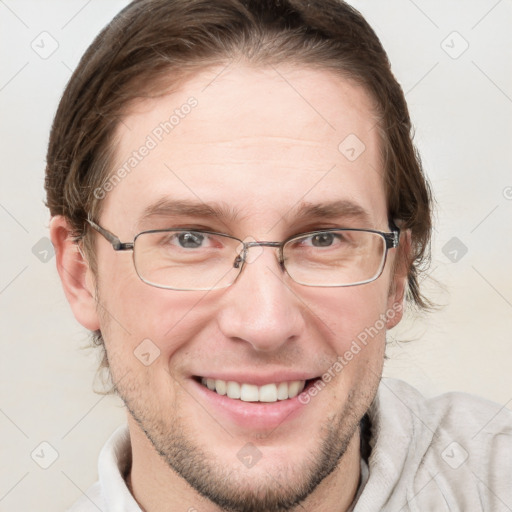 Joyful white adult male with short  brown hair and grey eyes