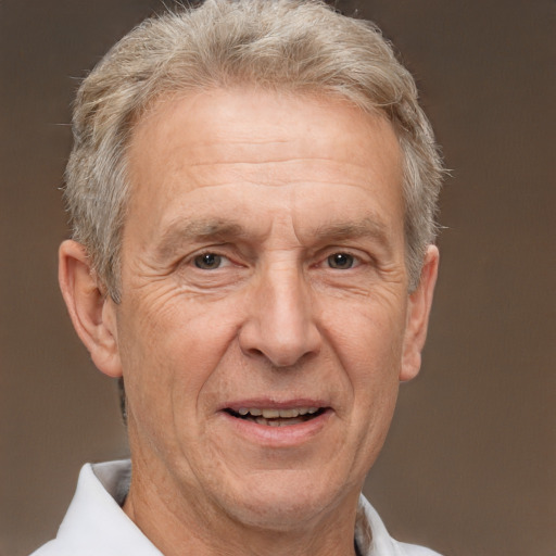 Joyful white middle-aged male with short  gray hair and brown eyes