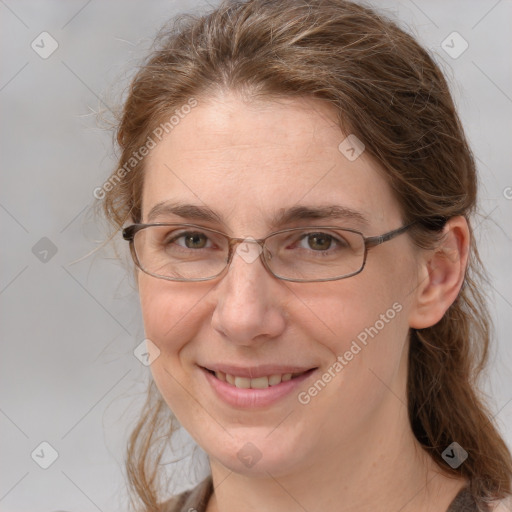 Joyful white adult female with medium  brown hair and grey eyes