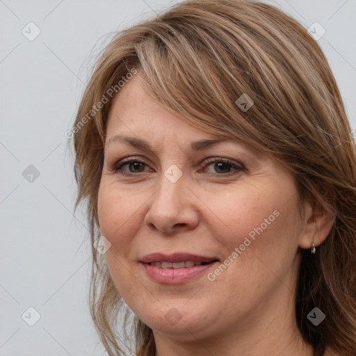 Joyful white adult female with medium  brown hair and grey eyes