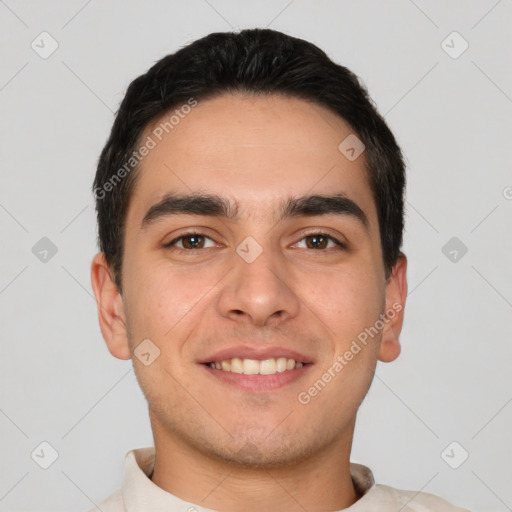 Joyful white young-adult male with short  black hair and brown eyes