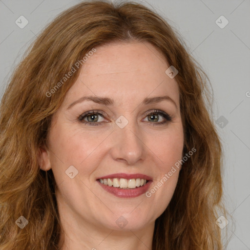 Joyful white young-adult female with long  brown hair and green eyes