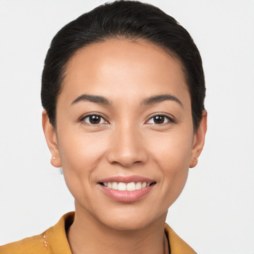 Joyful latino young-adult female with short  brown hair and brown eyes