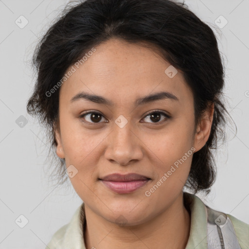 Joyful latino young-adult female with medium  brown hair and brown eyes