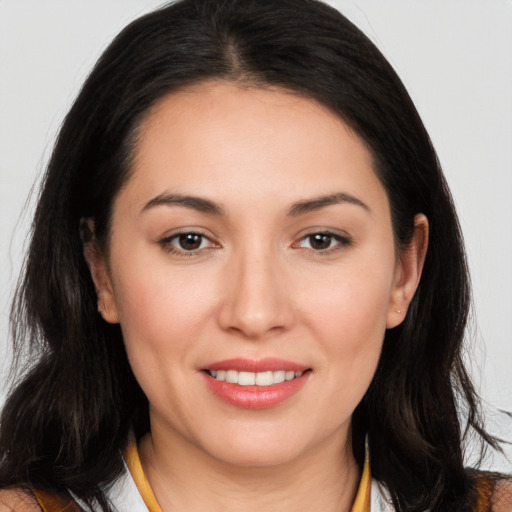 Joyful white young-adult female with long  brown hair and brown eyes