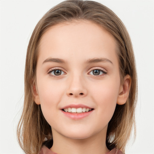 Joyful white child female with long  brown hair and grey eyes