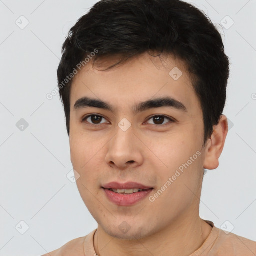 Joyful asian young-adult male with short  black hair and brown eyes