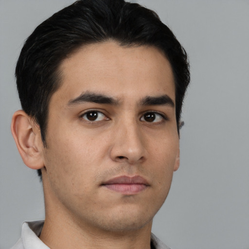 Neutral white young-adult male with short  black hair and brown eyes
