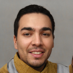 Joyful white young-adult male with short  black hair and brown eyes