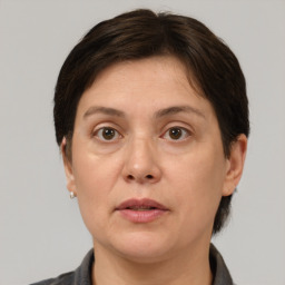 Neutral white adult female with short  brown hair and brown eyes