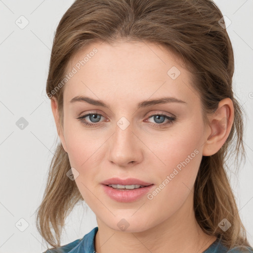 Joyful white young-adult female with medium  brown hair and blue eyes