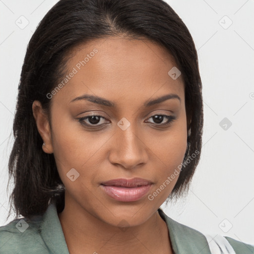 Joyful black young-adult female with long  brown hair and brown eyes