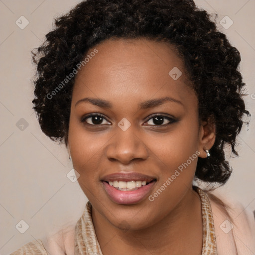 Joyful black young-adult female with long  brown hair and brown eyes