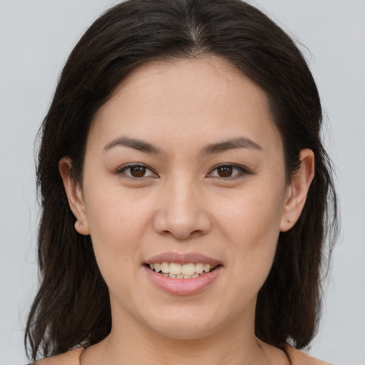 Joyful white young-adult female with medium  brown hair and brown eyes