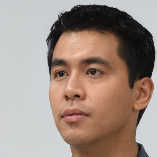 Neutral asian young-adult male with short  black hair and brown eyes