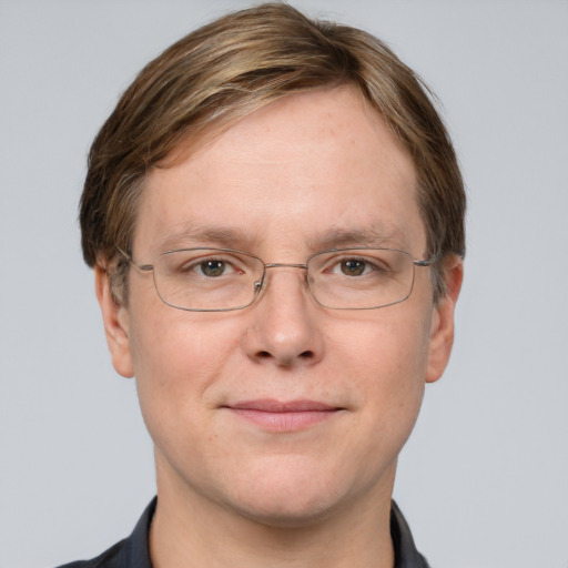 Joyful white adult male with short  brown hair and grey eyes