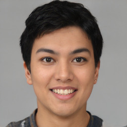 Joyful asian young-adult male with short  black hair and brown eyes