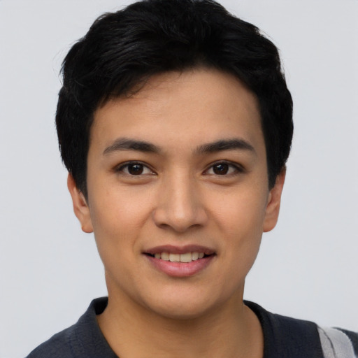 Joyful asian young-adult female with short  black hair and brown eyes