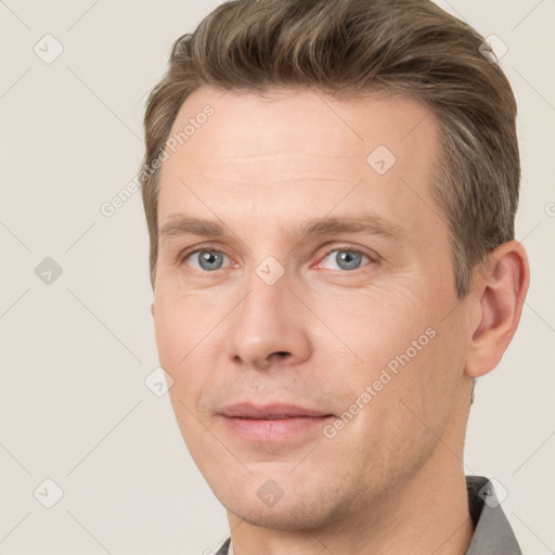 Joyful white adult male with short  brown hair and grey eyes