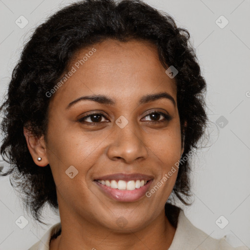 Joyful black young-adult female with long  brown hair and brown eyes