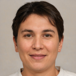 Joyful white adult female with short  brown hair and brown eyes