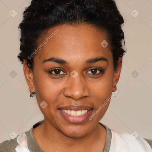 Joyful black young-adult female with short  black hair and brown eyes