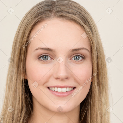 Joyful white young-adult female with long  brown hair and green eyes