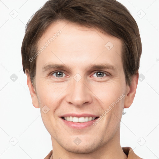 Joyful white young-adult male with short  brown hair and grey eyes