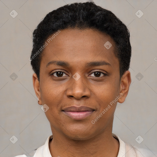 Joyful black young-adult female with short  black hair and brown eyes