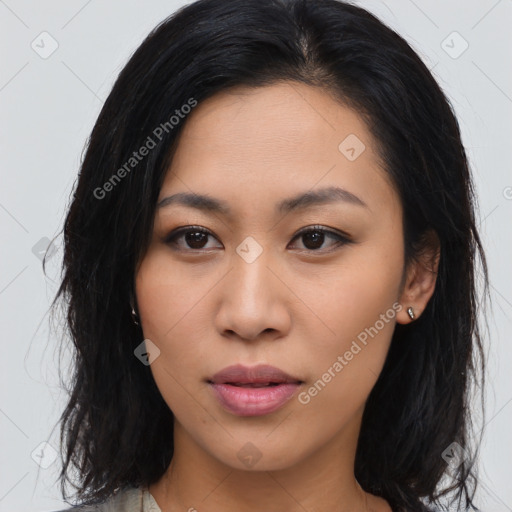 Joyful asian young-adult female with long  brown hair and brown eyes