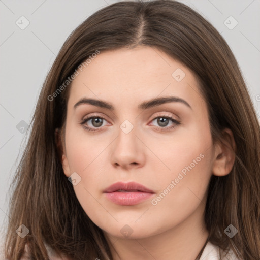 Neutral white young-adult female with long  brown hair and brown eyes