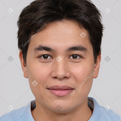 Joyful asian young-adult male with short  brown hair and brown eyes