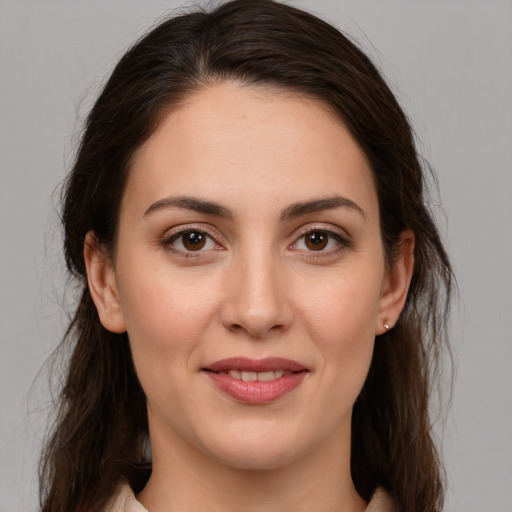 Joyful white young-adult female with medium  brown hair and brown eyes