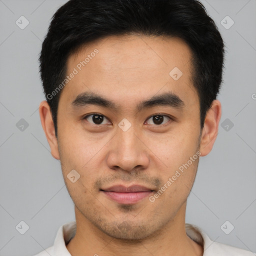 Joyful asian young-adult male with short  brown hair and brown eyes